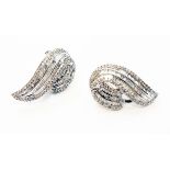 A pair of designer marked 750/18K white metal organic form ear-rings, each set with three rows of