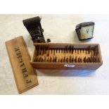 A vintage boxed brass stencil set - sold with a travelling alarm clock and a Kodak vest pocket