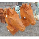 A pair of cast iron horse heads