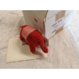 A Steiff red felt elephant model number 035814 complete with original tags, retailer box and