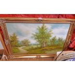 C. Inness: a gilt framed oil on canvas depicting a rural landscape with track and pool - signed