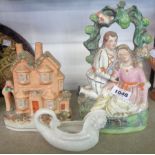 A Staffordshire figure of a courting couple under a bough - sold with a Staffordshire flatback