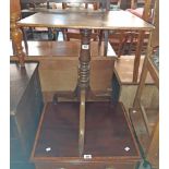 An occasional pedestal table A 21" antique oak pedestal tilt-top table, set on ring turned pillar