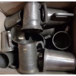 A box containing a quantity of assorted pewter tankards