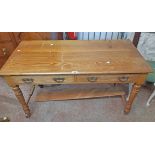 A 4' Edwardian stained mixed wood dressing table with two drawers and flanking shelves to