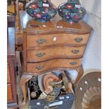 A 20 1/2" reproduction walnut serpentine front bedside chest of three long drawers, set on