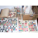 A collection of 20th Century world stamps in schoolboy albums, loose, on paper and sheets, also
