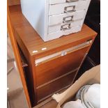 A Caplan teak effect three drawer filing cabinet