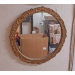 A small vintage gilt framed circular wall mirror