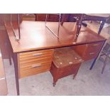 A 4' 5 1/2" 20th Century teak effect knee-hole office desk with four flanking drawers, set on