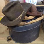 A modern Stetson and two other hats