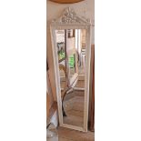 A modern full length dressing mirror with decorative pierced pediment, cream finish frame and