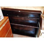 A 4' 4" stained and varnished wood three shelf open bookcase, set on standard ends
