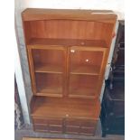 A 3' 4 1/2" Nathan Furniture cabinet with shelf pair of glazed panel doors and recess over pair of