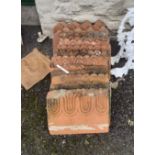 Sixteen Victorian terracotta lawn edging tiles - various styles and condition
