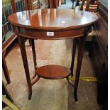 A 23 1/2" 1920's stained walnut two teir occasional table with oval surfaces, set on swept square