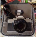A Praktica Super TL1000 35mm camera with Pentacon lens and soft case