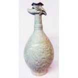 A 17" antique Chinese celadon phoenix head vase decorated with dragons fighting phoenix