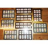A collection of various framed sets of cigarette cards - various maker and subjects