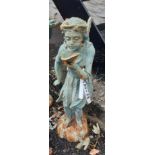 A cast iron standing fairy with leaf