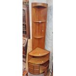 A 25" Nathan Furniture retro design teak effect corner unit with open shelves, recess and double