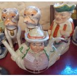 A 19th Century Toby teapot with legs akimbo, a Mr Punch Toby jug, and a pair of Sutherland bone