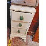A 12" painted wood pedestal chest of three drawers, set on bracket feet