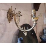 A pair of gothic revival gilt brass wall sconces