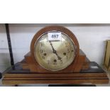 A 1930's walnut and part ebonised cased mantel clock with added platform escapement to German