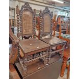 A pair of Victorian ornate carved oak framed high back standard chair in the Jacobean style with