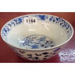 An antique Chinese blue and white bowl decorated with birds and flowers, four character mark to