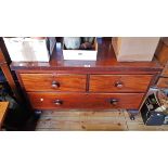 A 3' 4 1/4" 19th Century mahogany low chest of two short and one long drawer, set on associated