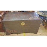 A 3' 5" Oriental camphor wood lift-top linen chest with part carved decoration to top, front and