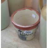 An old Maypole Dairy butter crock