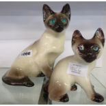 A Winstanley Siamese cat with glass eyes - sold with a similar kitten