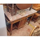 A 3' 6 1/4" Edwardian walnut washstand with red marble top, two frieze drawers and central cupboard