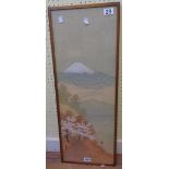 A gilt framed Japanese silk painting, depicting a view of Mount Fuji with figure and flowering trees