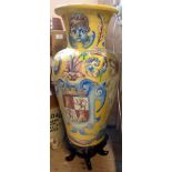 A large 20th Century Italian maiolica vase of baluster form, decorated with putti flanking a coat of