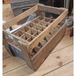 A vintage French wooden bottle crate