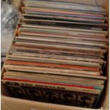 A box containing assorted vinyl LPs including Beatles, Dire Straits, Free, Eagles, Fleetwood Mac,