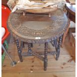 A 26" 1920's caved oak gateleg table, set on bobbin turned supports and decorative stretchers