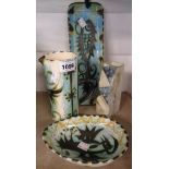 Three pieces of Celtic Pottery Newlyn Folk pattern comprising two dishes and a jug - sold with a