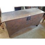 A 4' 4" antique oak coffer with iron latch and lock plate later carved decoration and applied