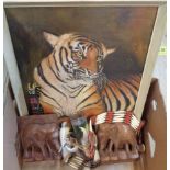 A box of assorted collectables including tiger painting, Native American items, elephant bookends,