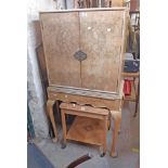A 31 1/2" 20th Century burr walnut veneered and mixed wood drinks cabinet with two doors and
