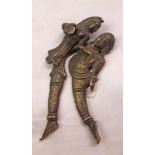 An antique Indian brass erotic cigar cutter
