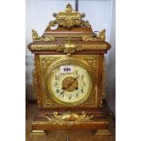 A 17" high late Victorian ornate polished oak and brass mounted bracket clock with Arabic numerals