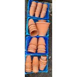 Four trays of terracotta flower pots