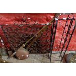 A wrought iron and mesh fire screen with fleur de lys design - sold with a copper warming pan, two