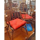A set of six old hoop stick back kitchen chairs with shaped splats and solid elm moulded seats,